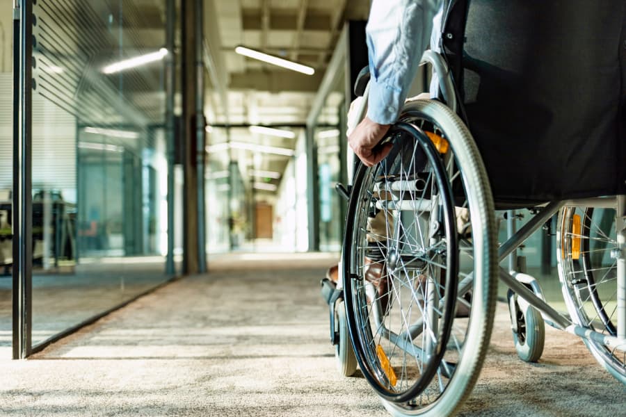 Close Up Shot Of A Person Sitting In A Wheelchair